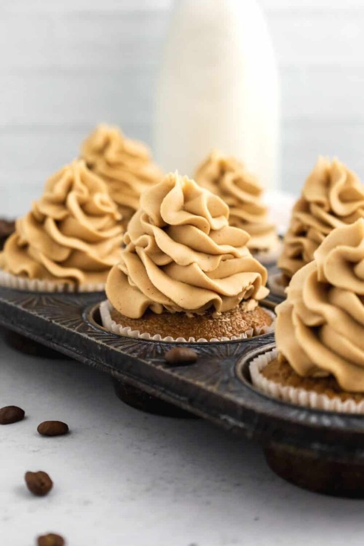 coffee cupcakes with coffee frosting in a muffin pan