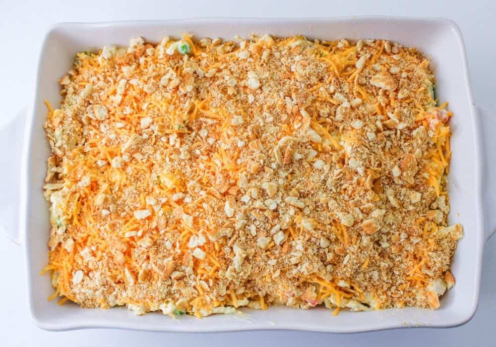 overhead view of a casserole dish with the chicken and hashbrown casserole ready to be baked