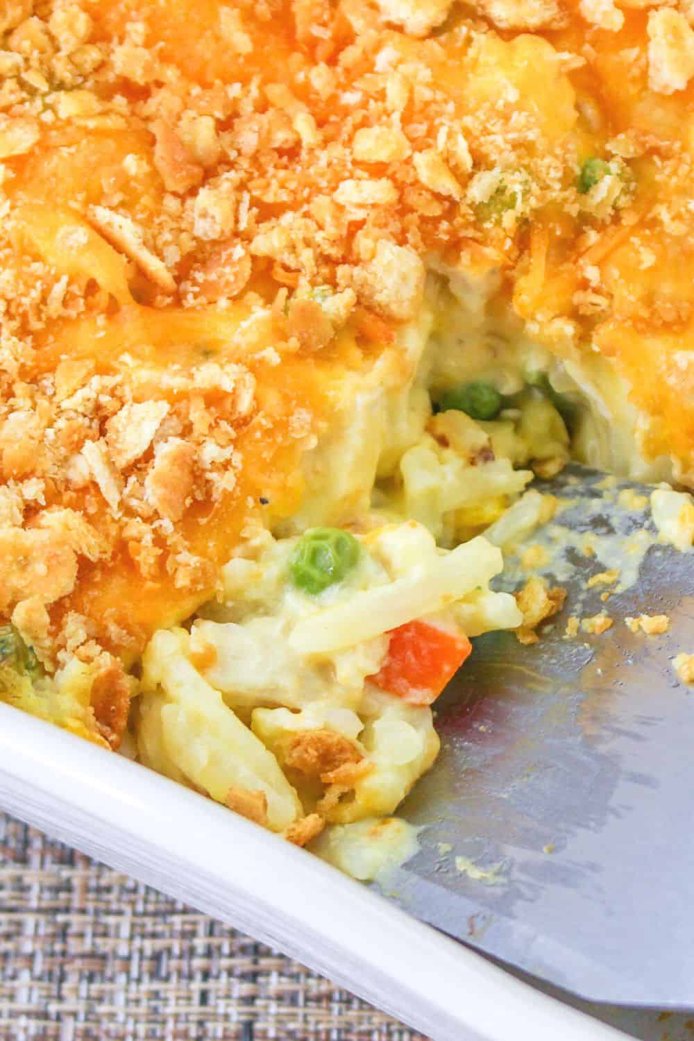 close-up view of the inside of the chicken and hash brown casserole, showing the potatoes, veggies, and chicken.