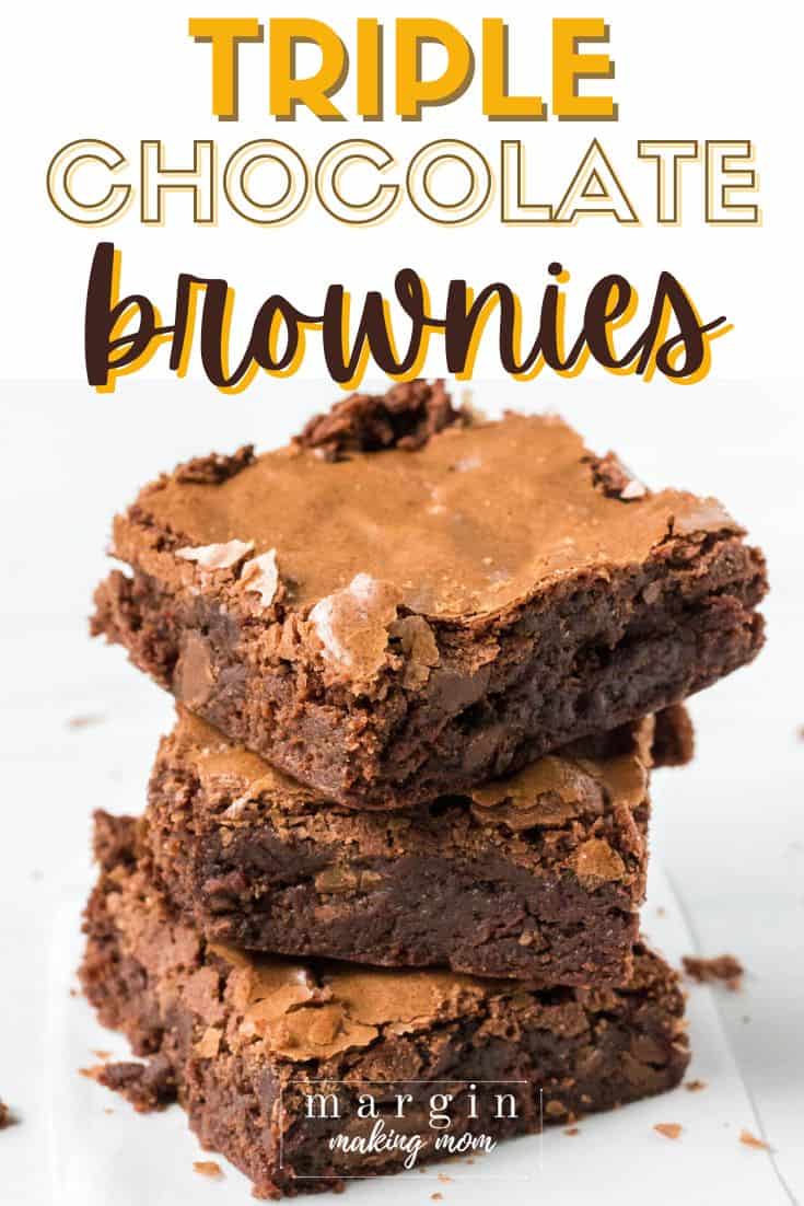 three triple chocolate brownies stacked on top of each other