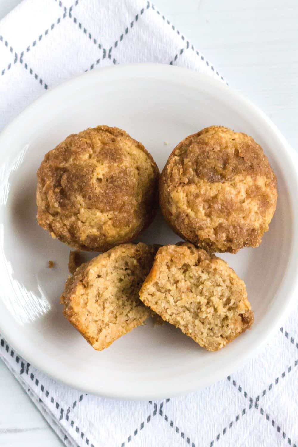 streusel-topped applesauce muffins made with Bisquick served on a white plate