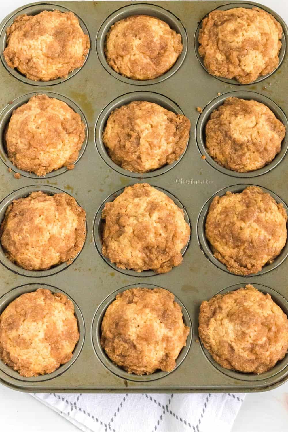 freshly baked Bisquick applesauce muffins, topped with streusel, still in the pan