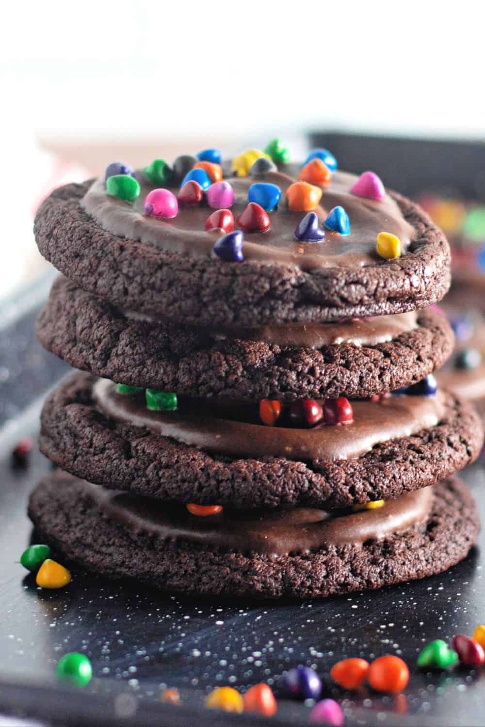four Cosmic Brownie inspired cookies stacked together