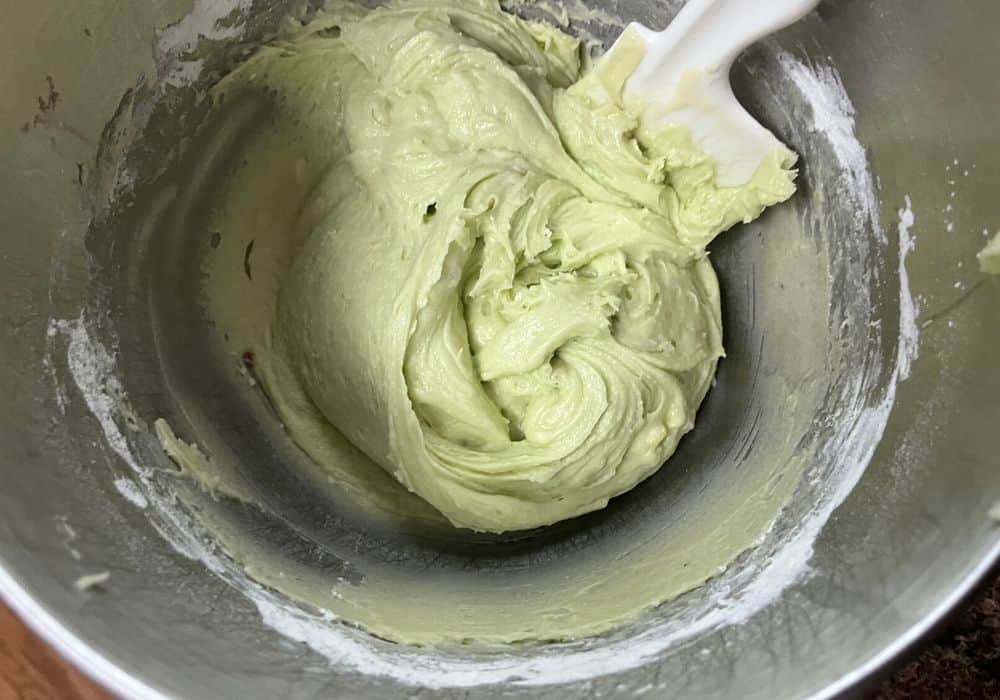 pistachio muffin batter in a mixing bowl