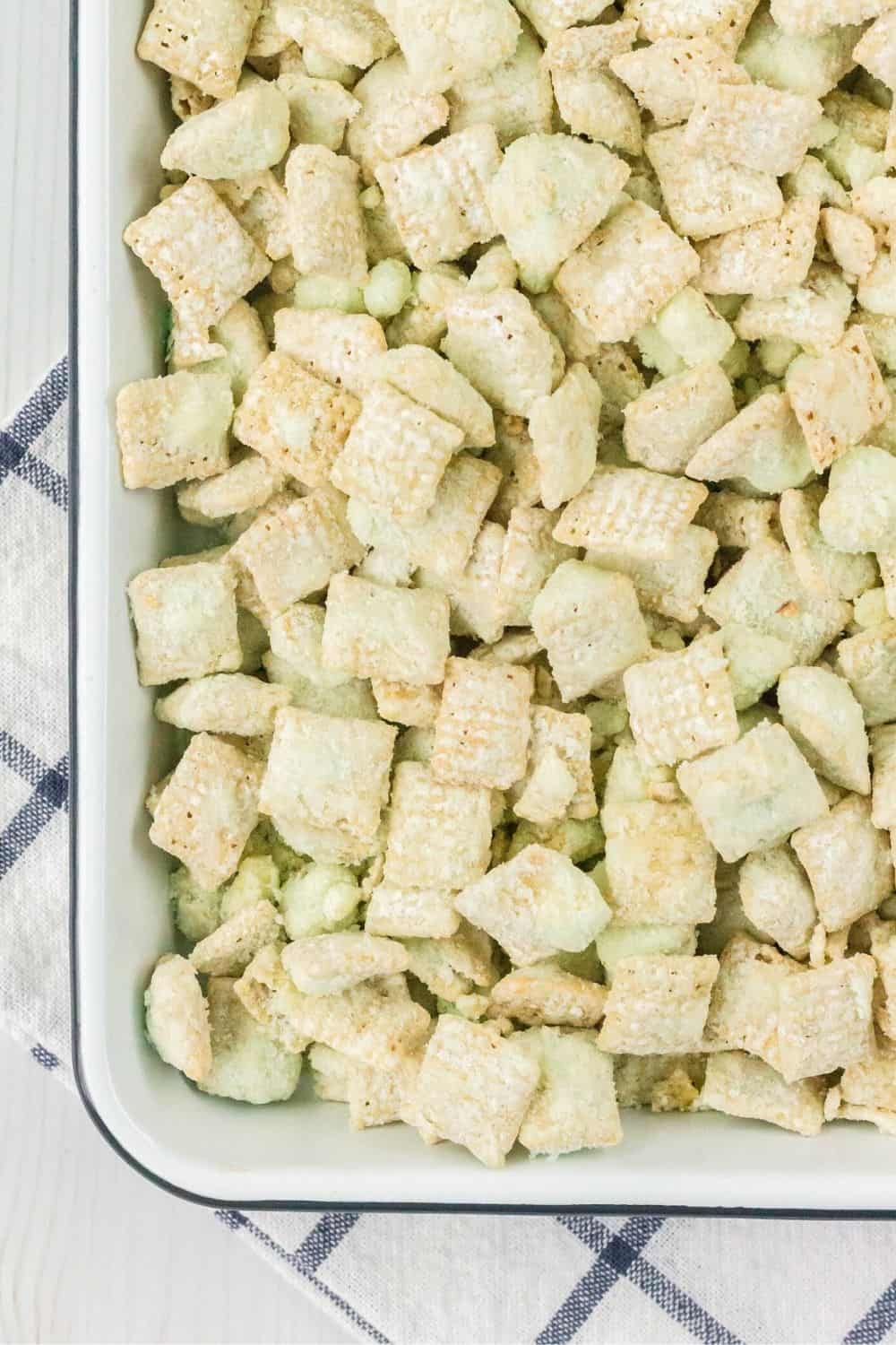 overhead view of a small sheet pan serving pistachio flavored chex mix