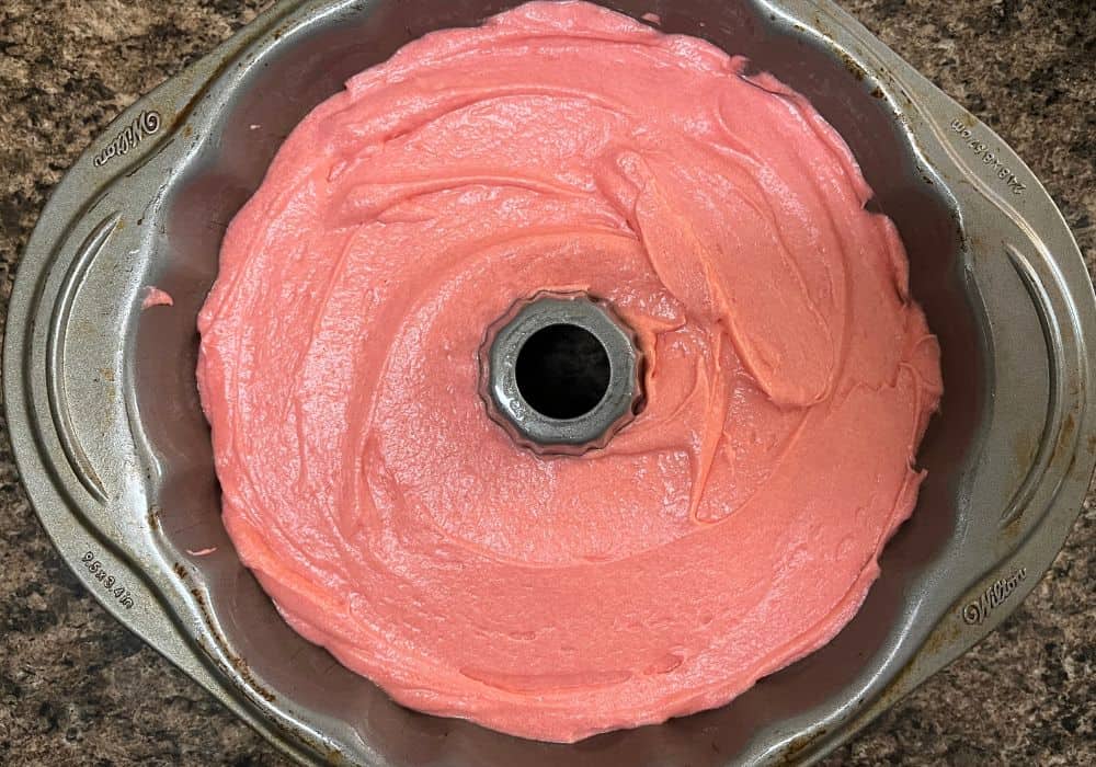 strawberry crunch pound cake batter in a bundt pan prior to baking