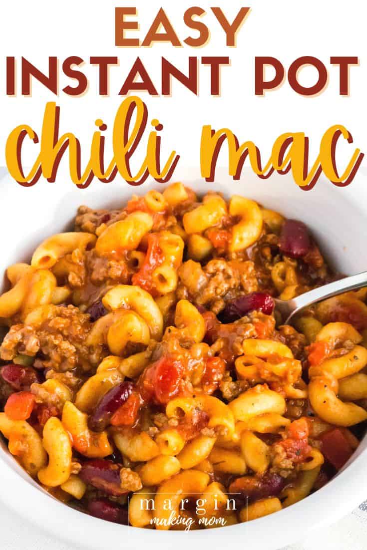 a white bowl of Instant Pot chili mac with a spoon in it.