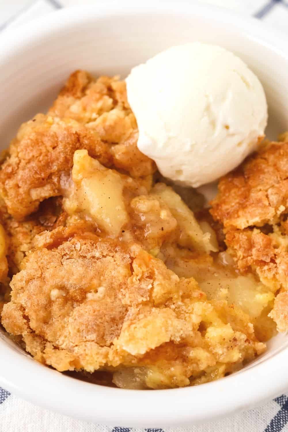 close-up view of the crackled crunchy topping of the canned pear dump cake made with cake mix