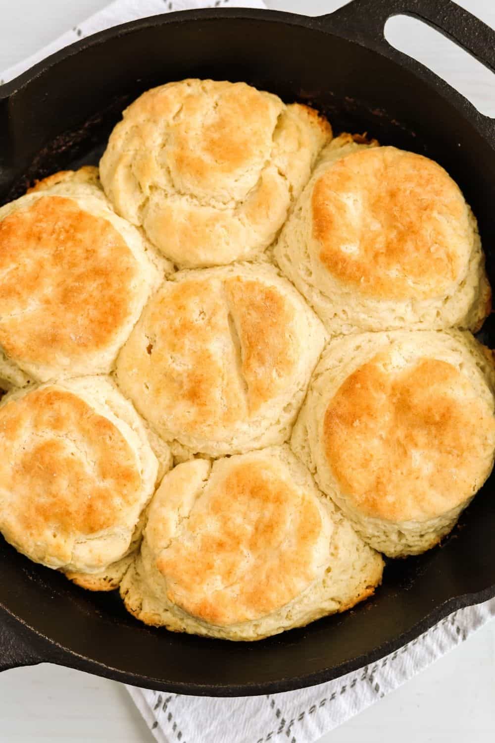 overhead view of a cast iron skillet full of freshly baked bisquick biscuits