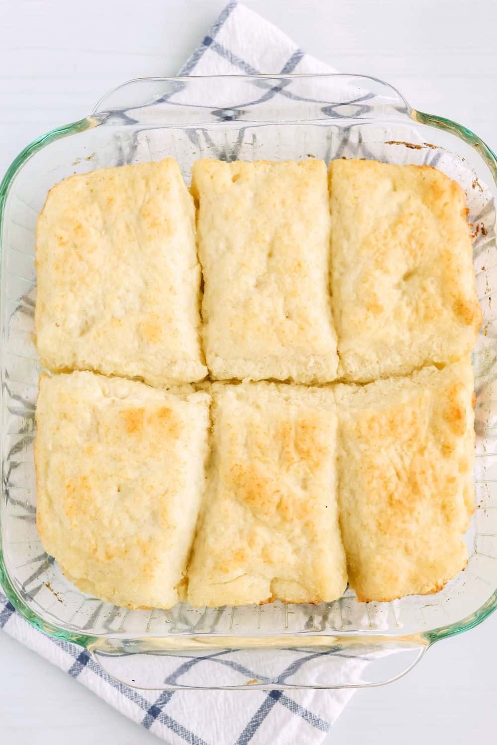 overhead view of a glass baking dish of biscuits made with 7-up soda