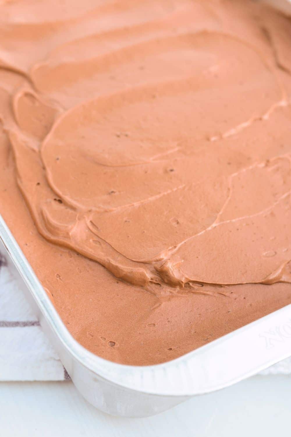 close-up view of chocolate Dream Whip frosting spread over a Dream Whip cake