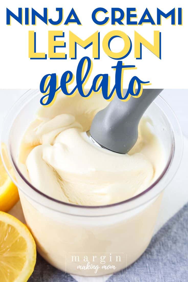 a pint of Ninja Creami lemon gelato, with an ice cream scoop in it and lemon halves next to it.