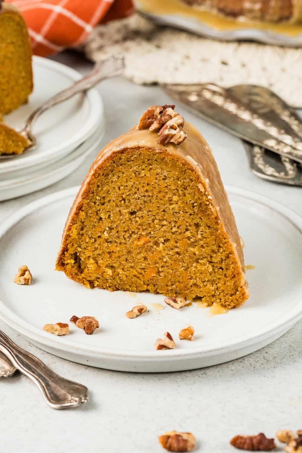 a slice of pound cake made with sweet potatoes, served on a white plate.