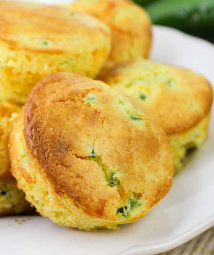 Jiffy jalapeno cornbread muffins served on a white plate.