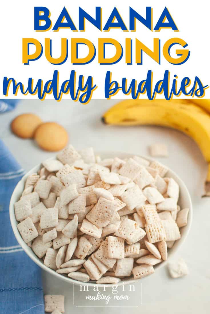 banana pudding muddy buddies served in a white bowl, with vanilla wafers and bananas in the background.