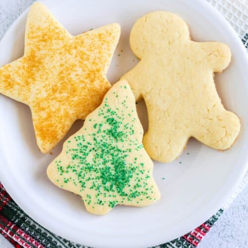 Three cake mix holiday cookies served on a white plate.