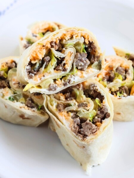 Big Mac pinwheels on a white appetizer plate.