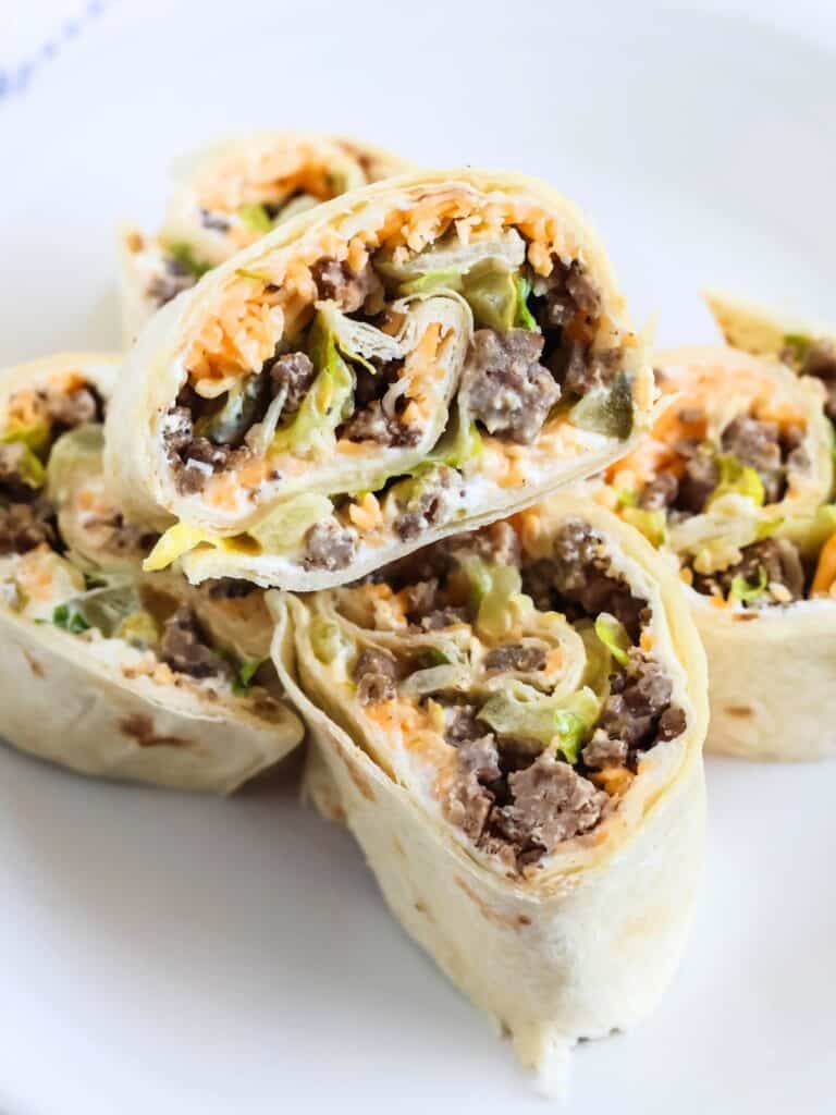 Big Mac pinwheels on a white appetizer plate.
