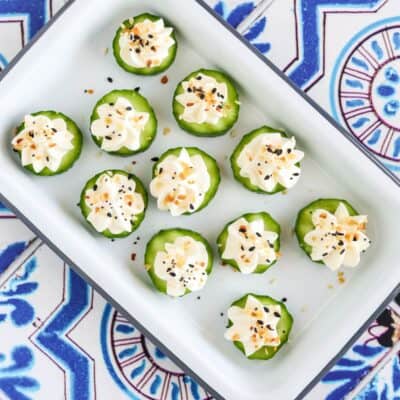 everything bagel cucumber bites served on an appetizer platter.