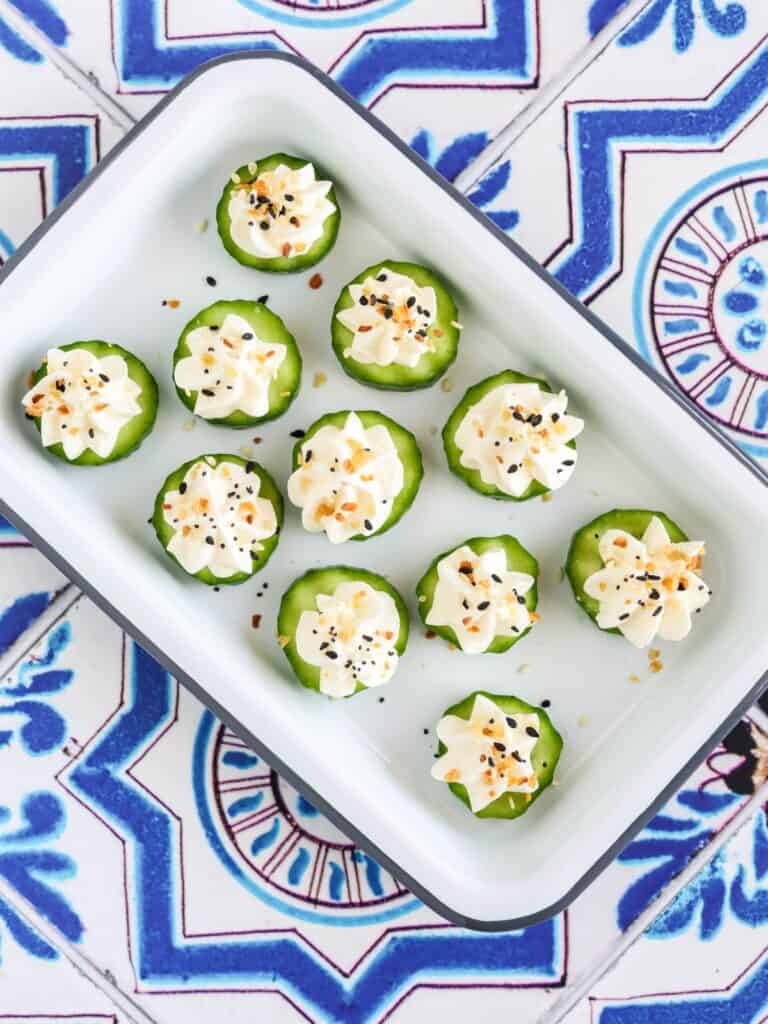 everything bagel cucumber bites served on an appetizer platter.