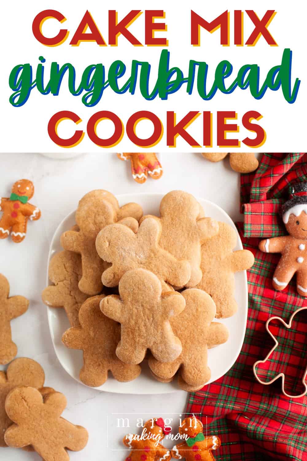 Cake mix gingerbread cookies served on a white plate, with Christmas decorations surrounding the plate.