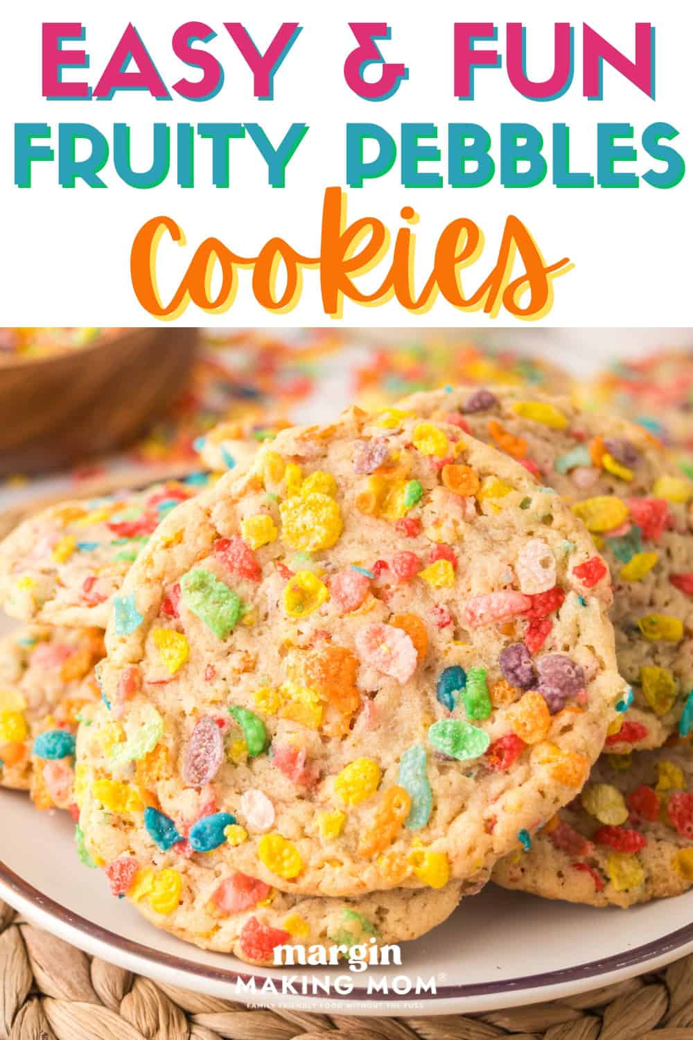close-up view of several Fruity Pebbles cookies on a white plate.