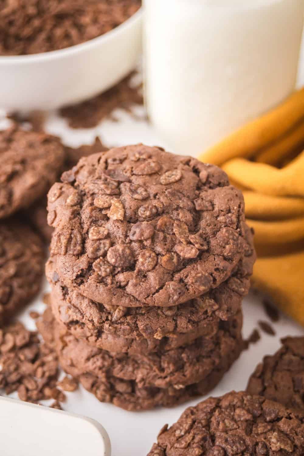 view of the top of a stack of Cocoa Pebbles cookies, showing the cereal on top.