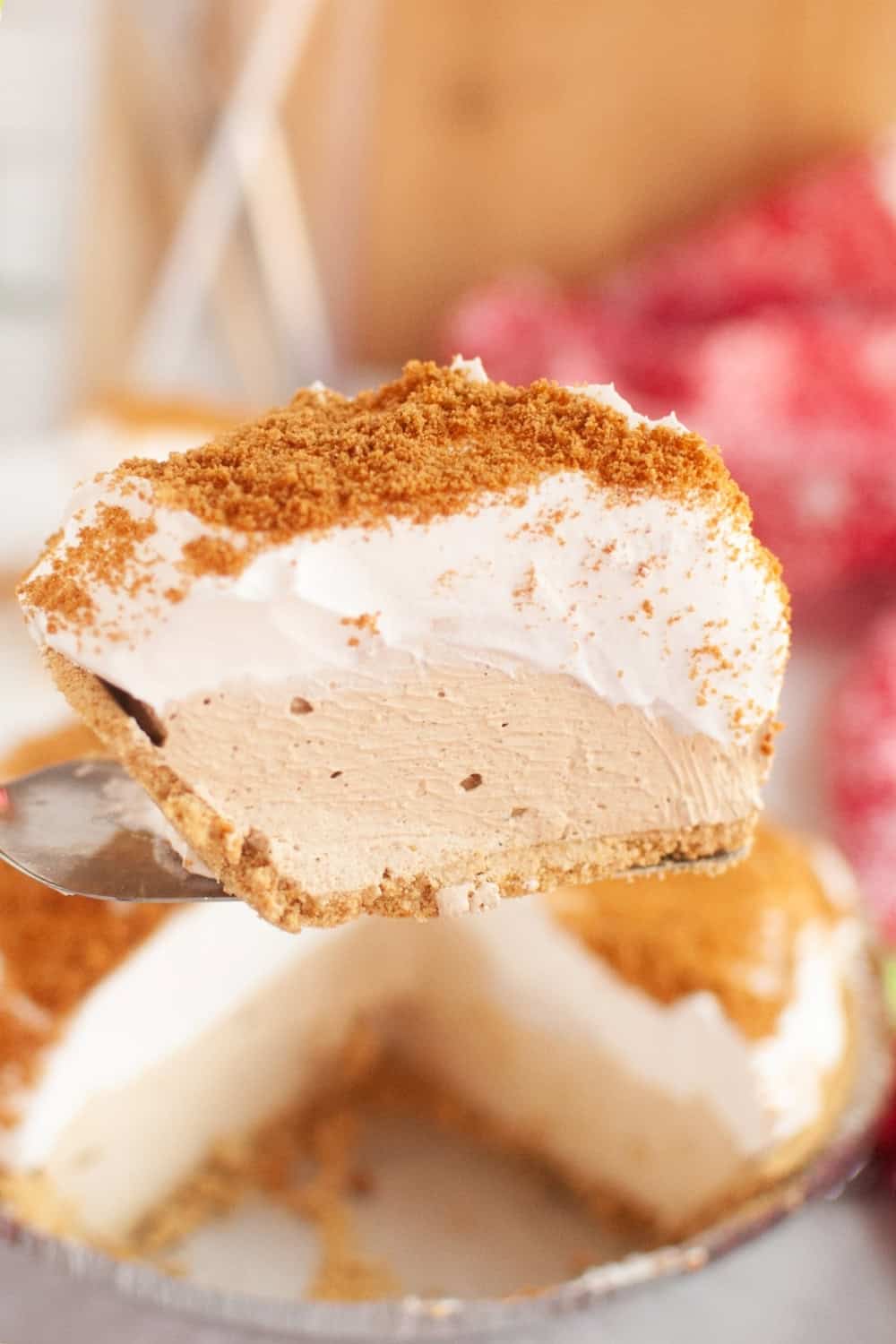 a pie server lifts a slice of no bake gingerbread pie out of the pan.