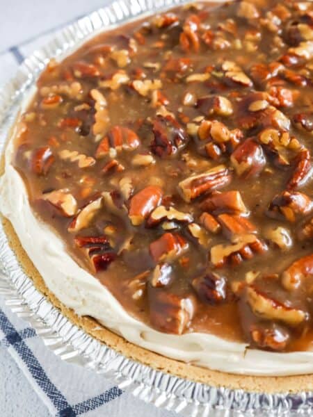 close-up side view of a no-bake pecan pie cheesecake.