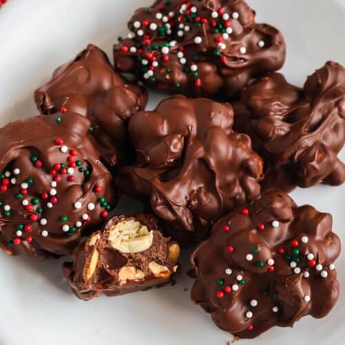 sugar free chocolate peanut clusters served on a white plate
