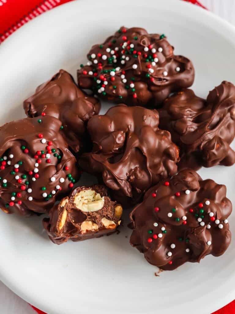 sugar free chocolate peanut clusters served on a white plate