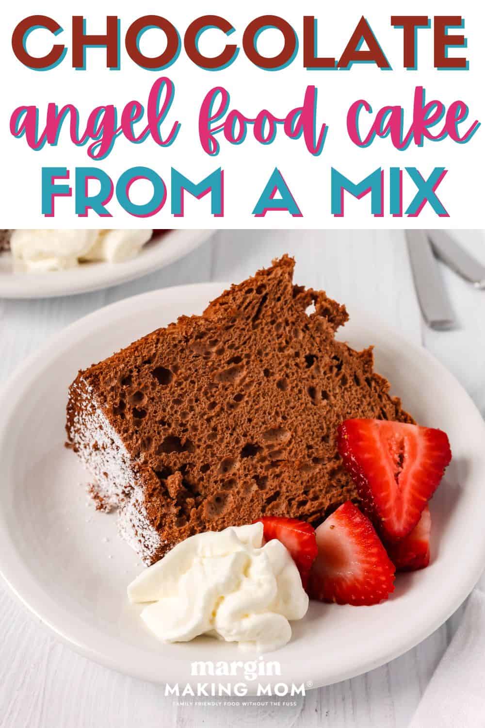 Slice of chocolate angel food cake made from a mix, served on a white plate with whipped cream and fresh strawberries.