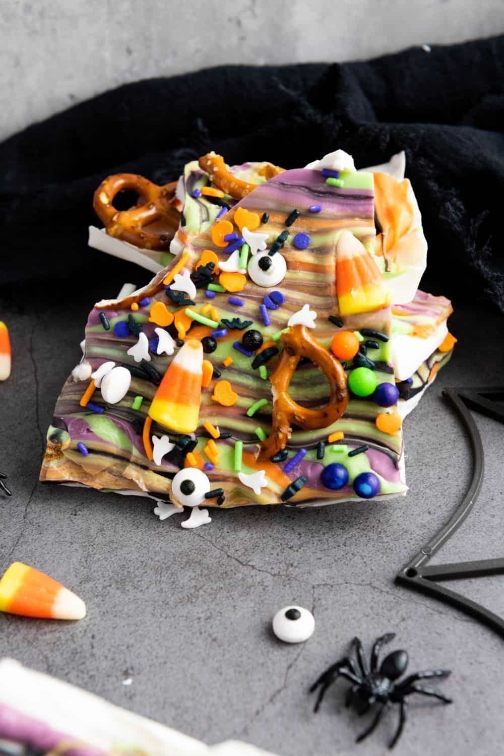 close-up view of a couple of pieces of colorful Halloween chocolate bark.