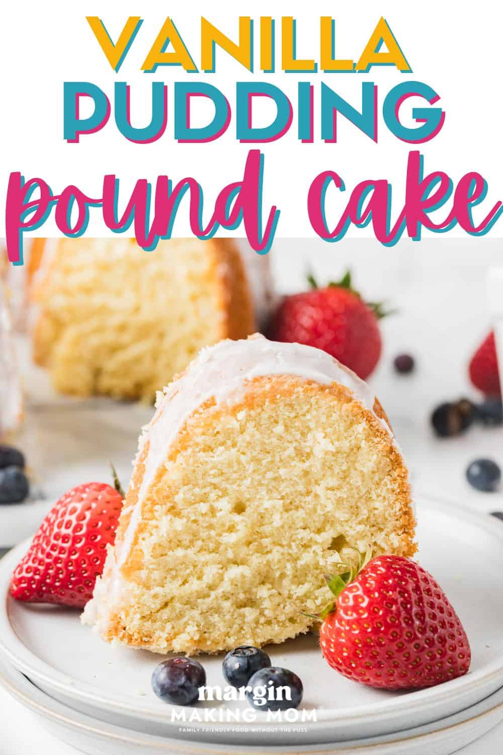 slice of vanilla pudding pound cake served on a white plate with fresh berries.