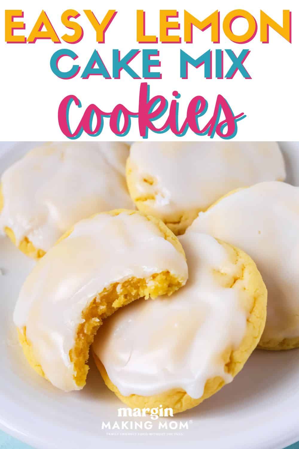 a few iced lemon cake mix cookies on a white plate. One cookie has a bite taken out of it, showing its soft and chewy texture.