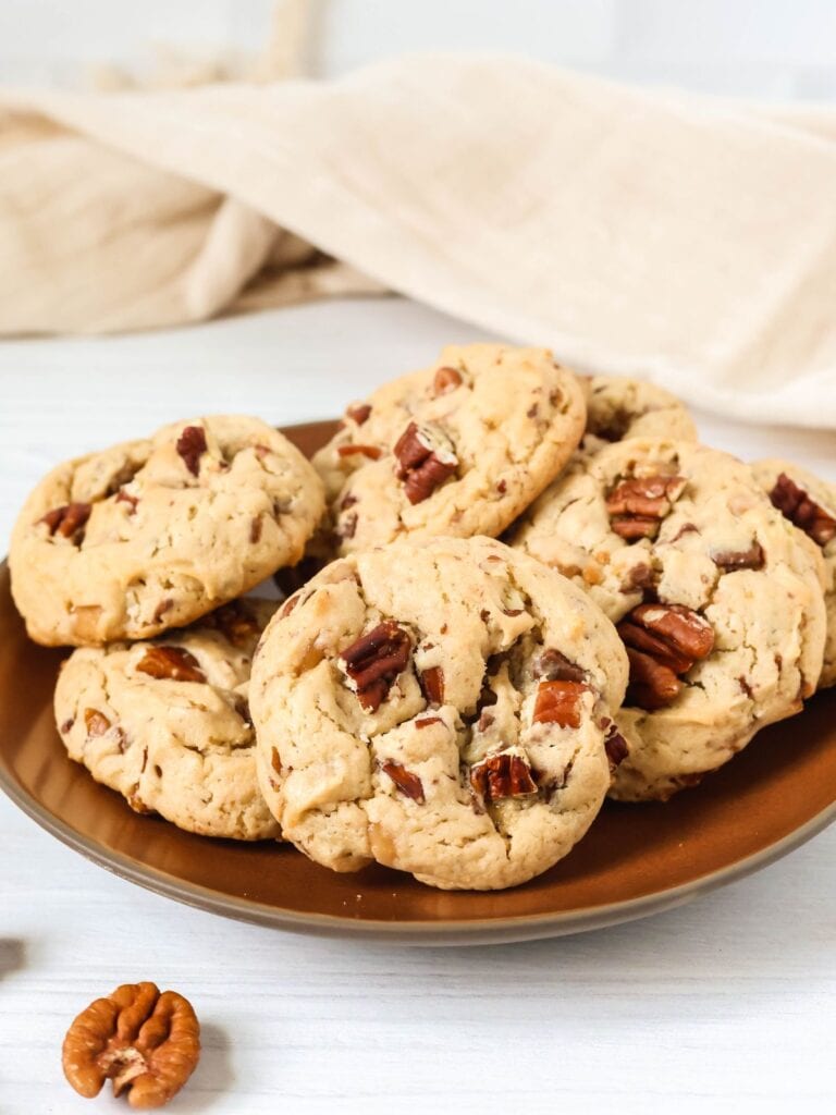 Cake mix butter pecan cookies served on a brown plate.