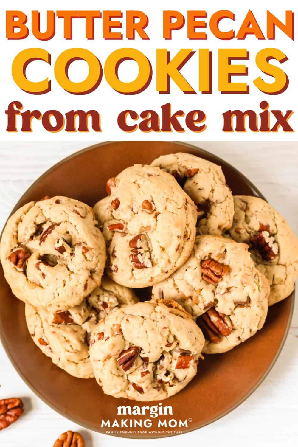 Several cake mix butter pecan cookies on a brown plate.