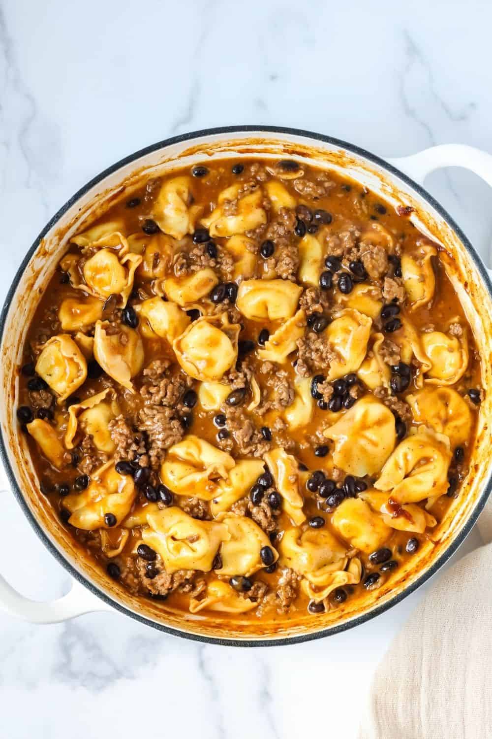 overhead view of a pan of enchilada tortellini casserole.