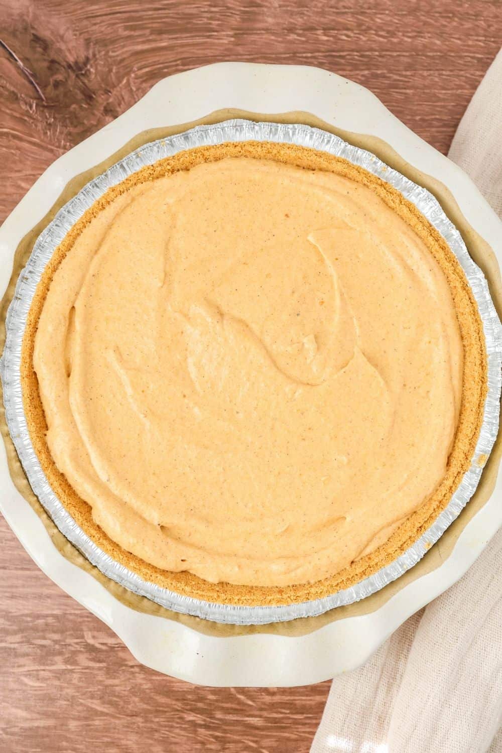 overhead view of a whole no bake pumpkin pie in a pie plate.