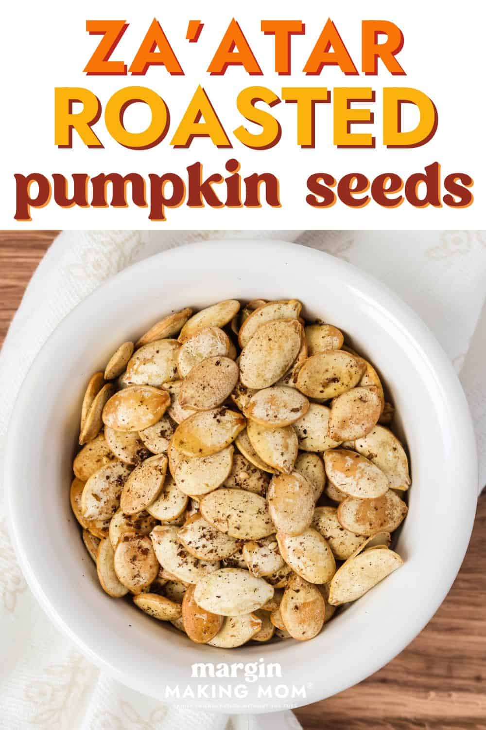 Za'atar pumpkin seeds served in a white bowl.