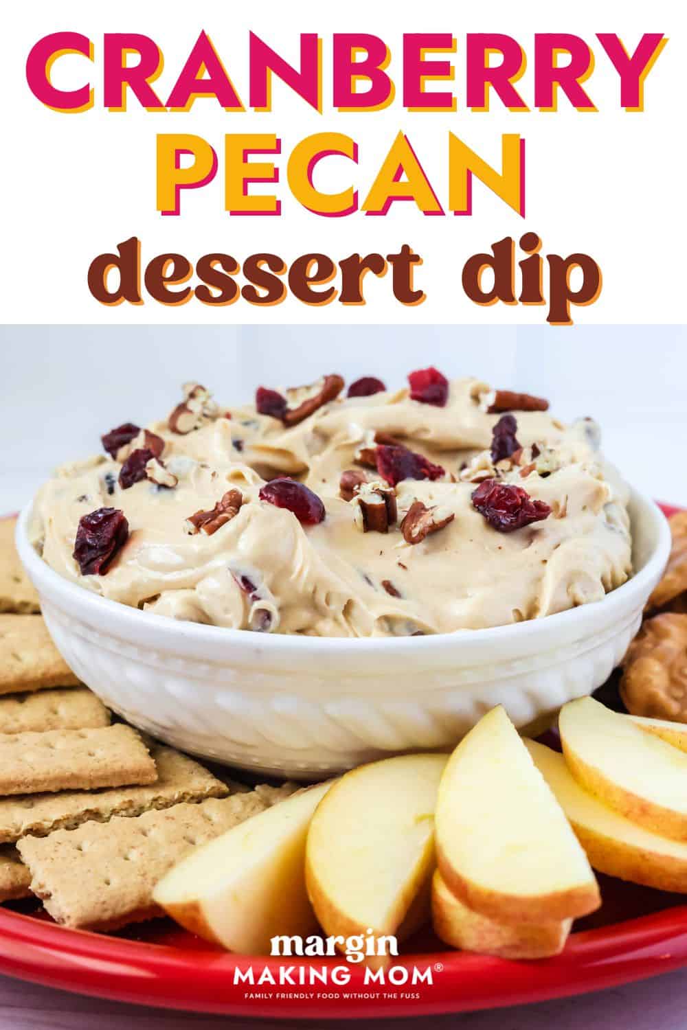 side view of a bowl of cranberry pecan dessert dip with dippers surrounding it.