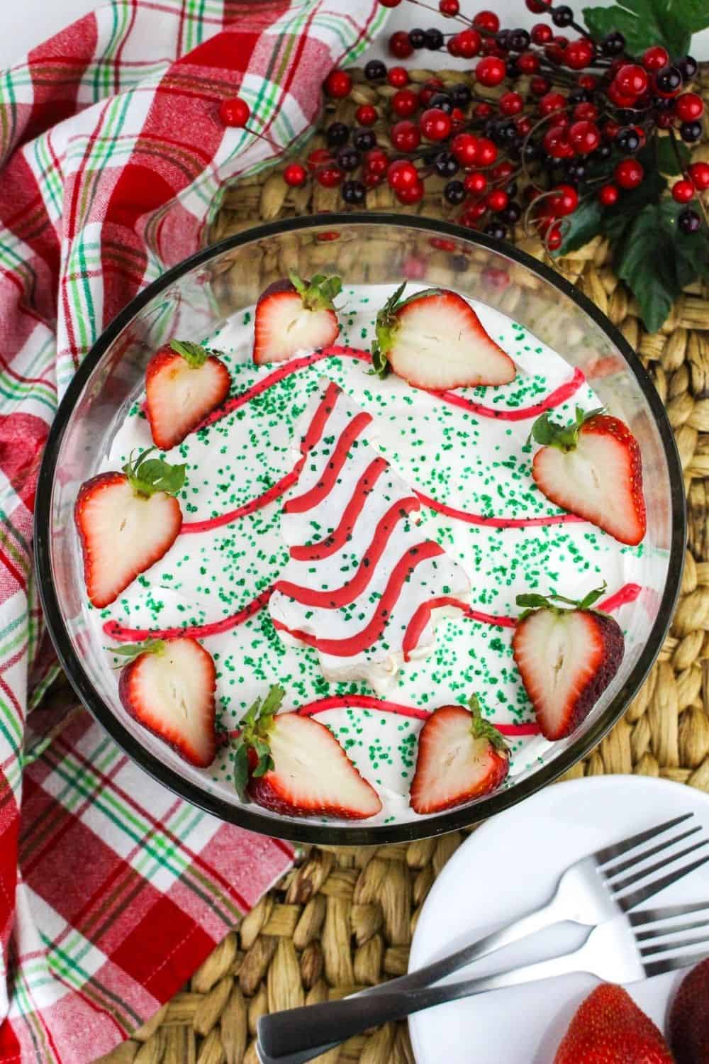 overhead view of a glass dish filled with holiday layered dessert made with Christmas Tree Cakes.