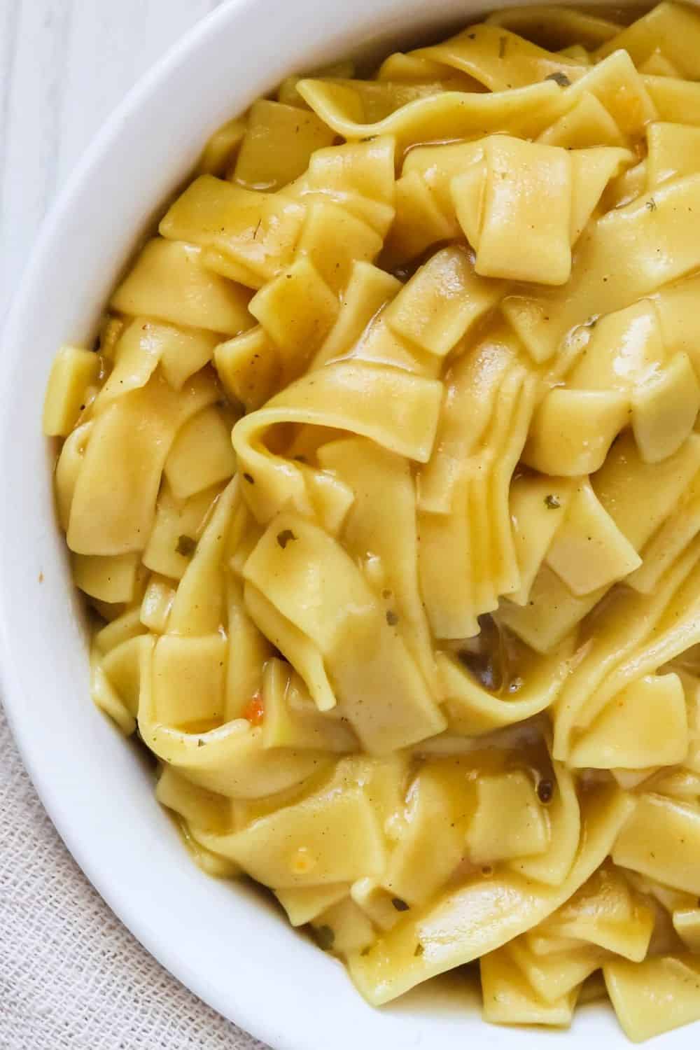 close-up overhead view of cooked chicken fettucine Knorr pasta sides served in a white bowl.