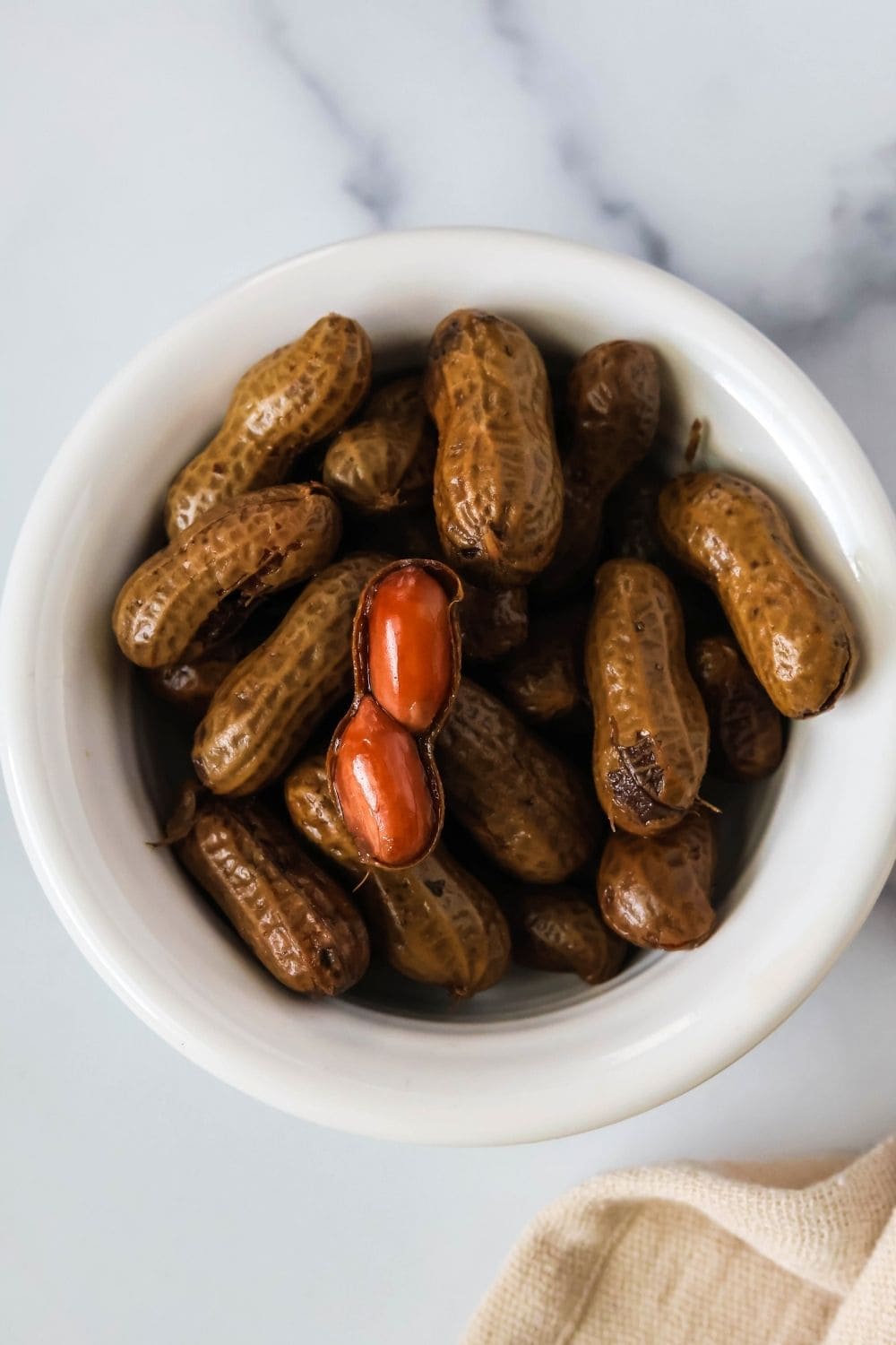 close-up view of freshly cooked boiled peanuts made in the crockpot slow cooker.