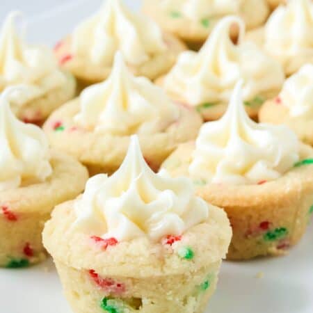 Christmas sugar cookie cups displayed on a white platter.