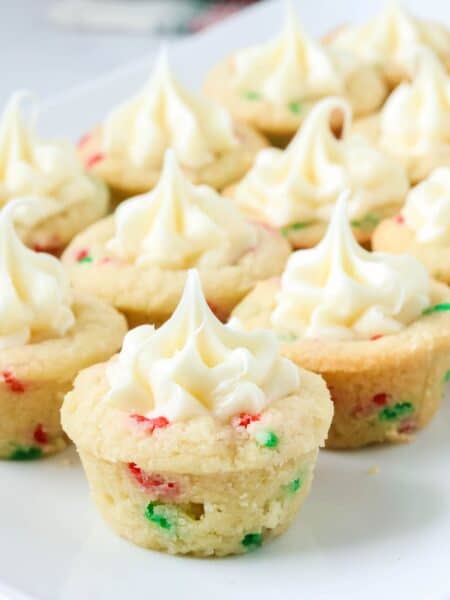 Christmas sugar cookie cups displayed on a white platter.