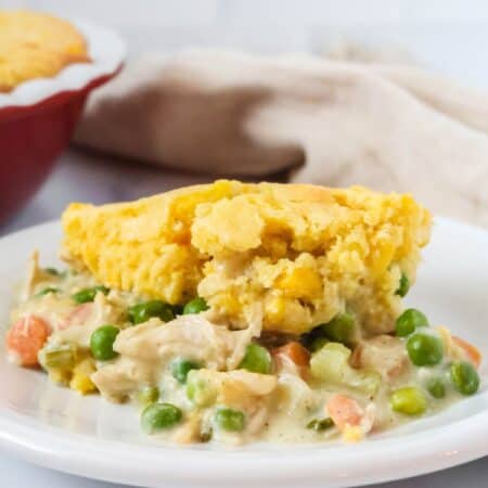 Cornbread chicken pot pie served on a white plate.