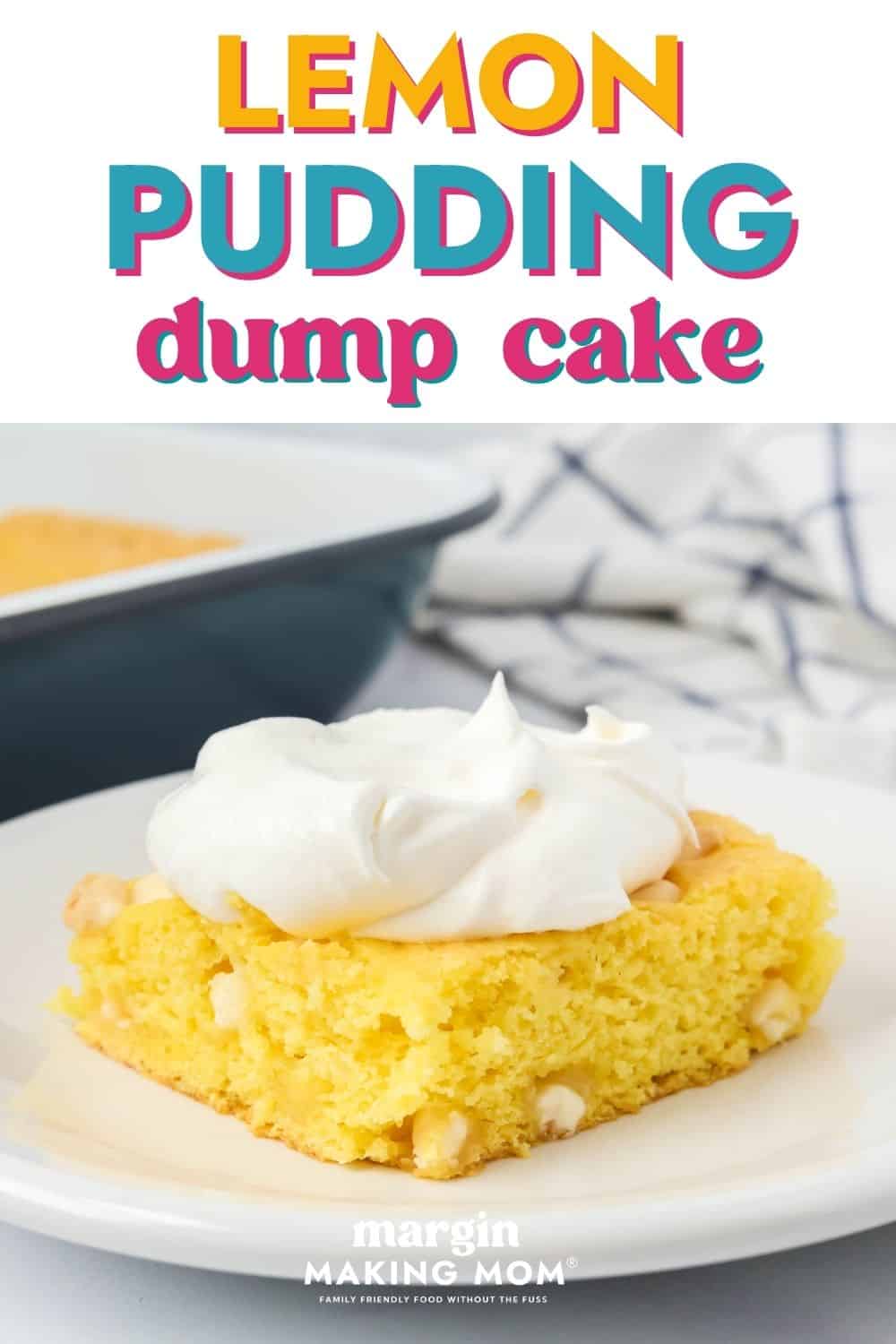 Slice of lemon pudding dump cake on a white dessert plate, garnished with whipped topping. The cake pan is in the background.