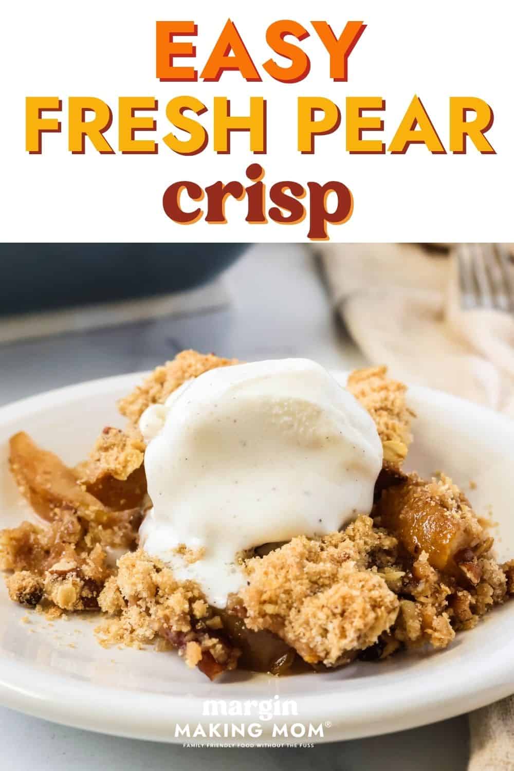 A serving of easy pear crisp made with fresh pears is served on a white plate, topped with vanilla ice cream that's melting from the warm crumble.