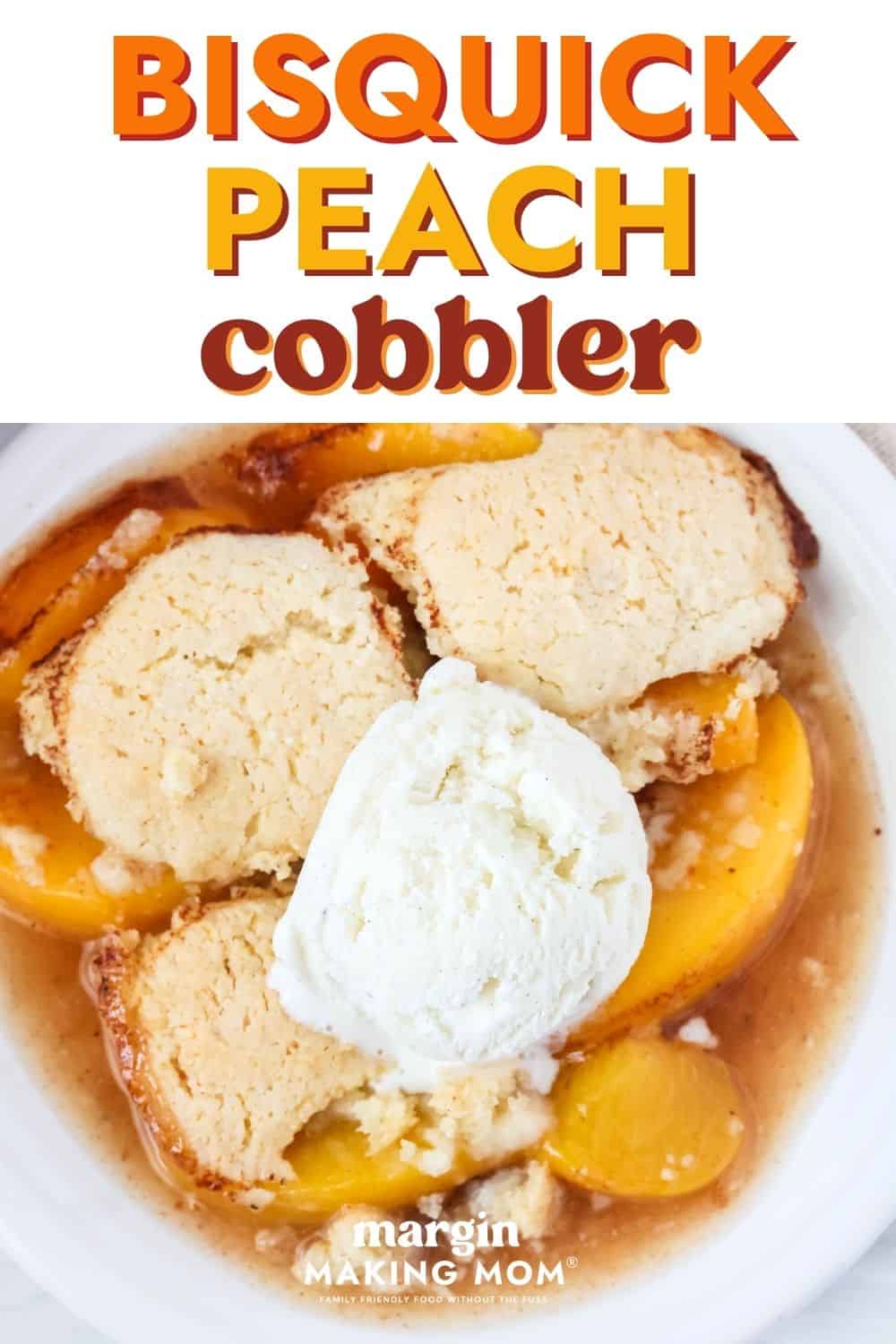 Bisquick peach cobbler on a white plate, topped with a scoop of vanilla ice cream.